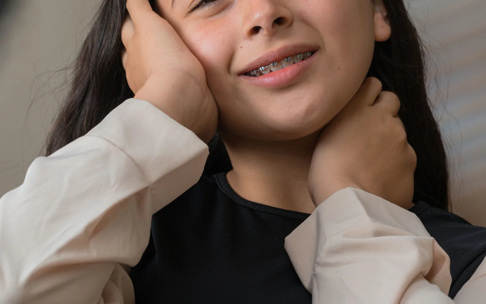Teenager smiling with orthodontic braces